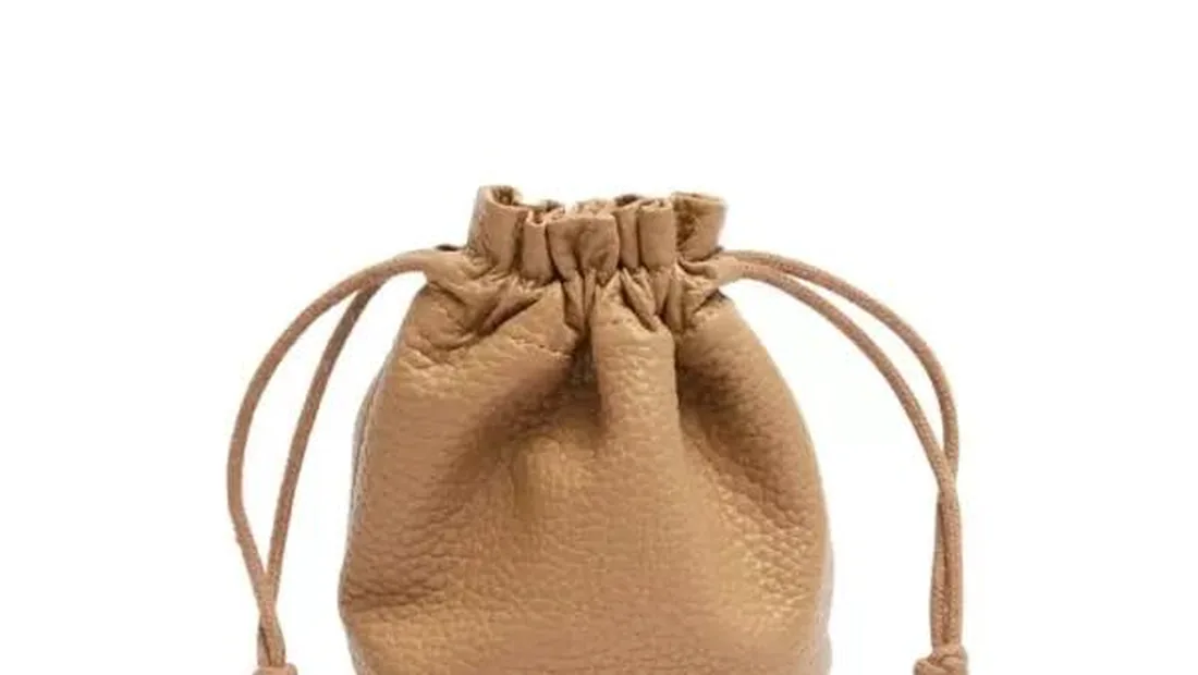 Drawstring bag with a gathered top and cord closure